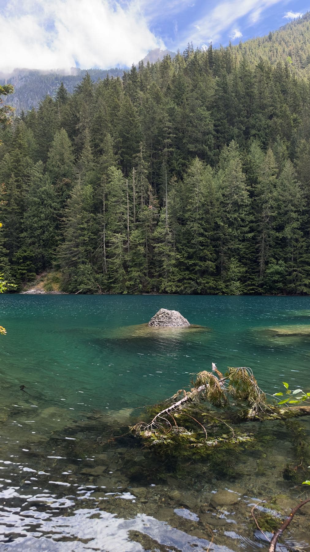 Turquoise lake with a rock island